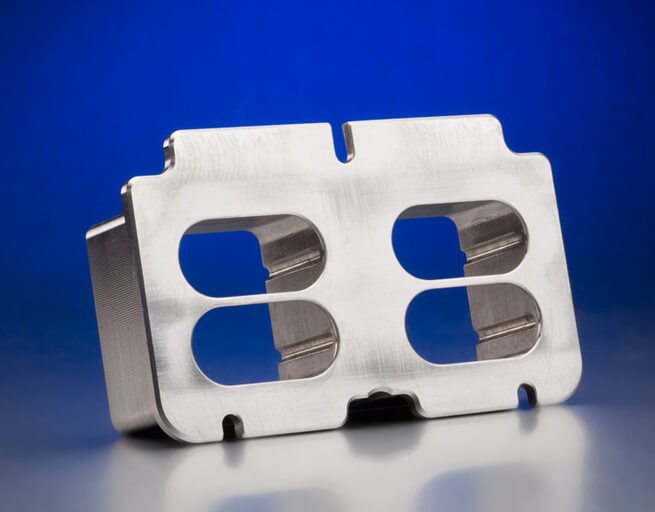Metal bracket with cutouts on blue background