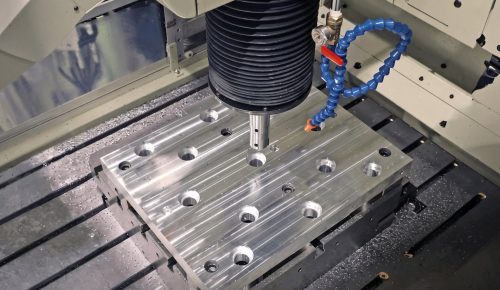 Jig boring machine boring a precise hole in aluminum block