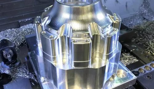 Large aluminum housing undergoing large part CNC machining on 5-axis machine