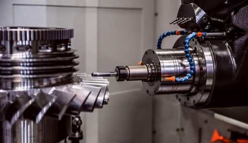 CNC milling cutter machining a steel gear housing in low volume CNC machining
