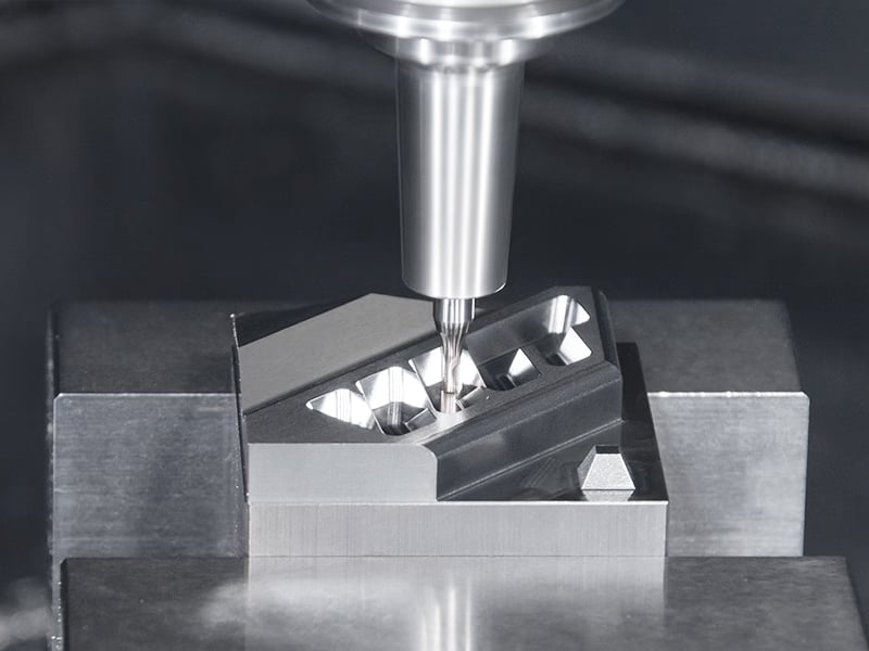 CNC milling machine drilling into metal workpiece