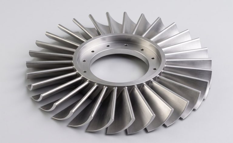 Metallic marine impeller with curved blades and central hub