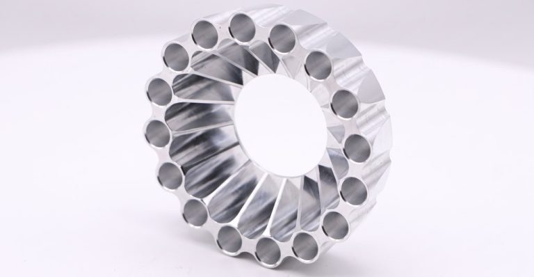 Circular aluminum heat sink with radial fins and holes