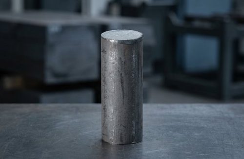 Raw mild steel S355J2 round bar stock before CNC machining