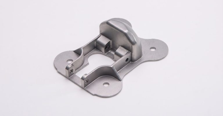 Precision machined metal bracket with mounting holes and cutouts