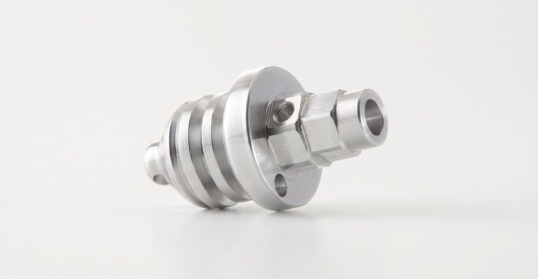 CNC machined metal part with flange and threaded sections
