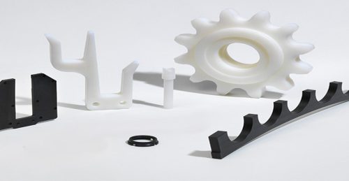 Nylon machined parts on white background