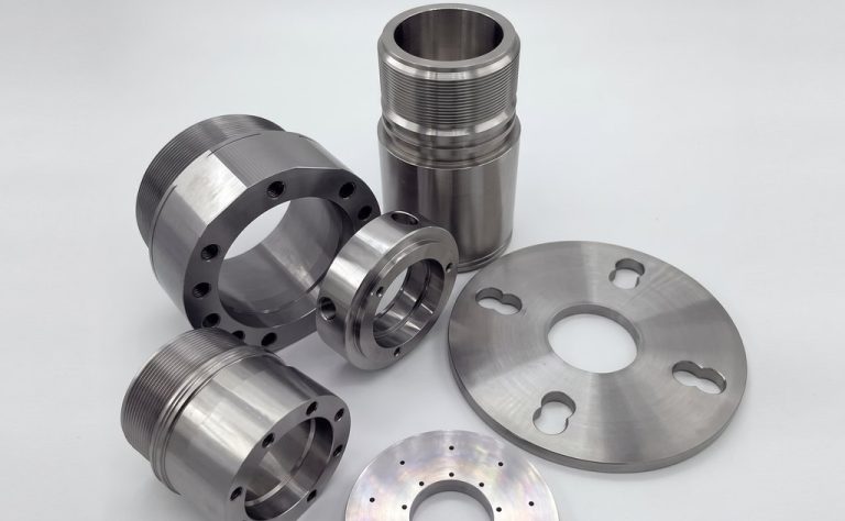 Precision machined metal components for oil and gas applications