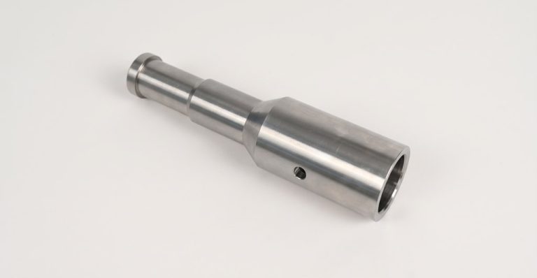 Precision machined metal shaft with smooth finish
