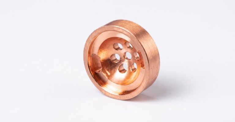 Copper machined part with multiple drilled holes