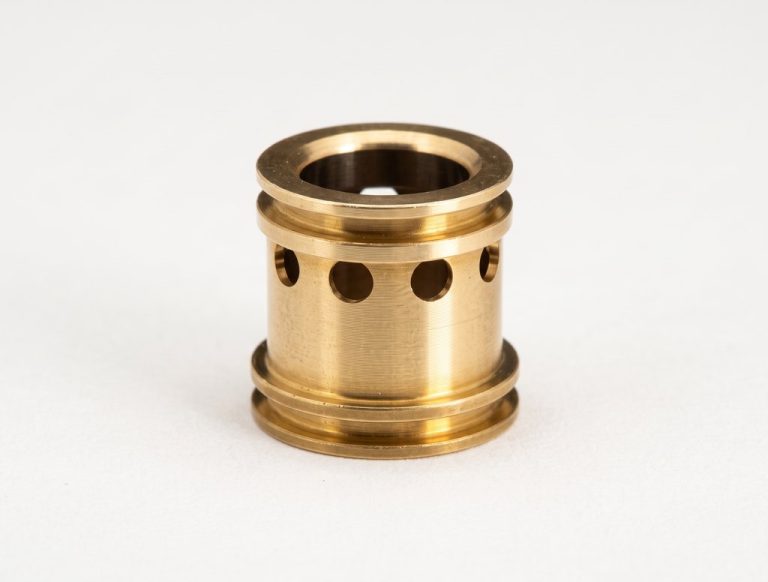 Brass cylindrical machined part with multiple holes