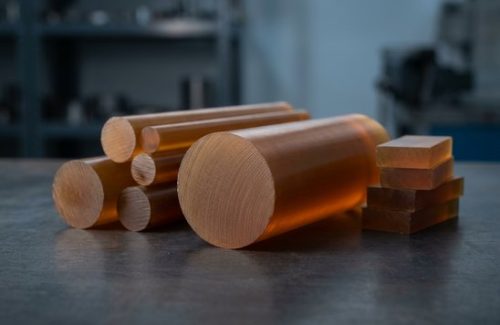 Raw PEI Ultem 1000 round bar stock before CNC machining