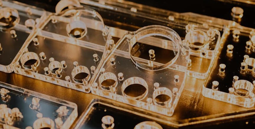 Clear acrylic machined parts with holes and features