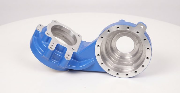 Blue painted metal housing with machined interior surfaces
