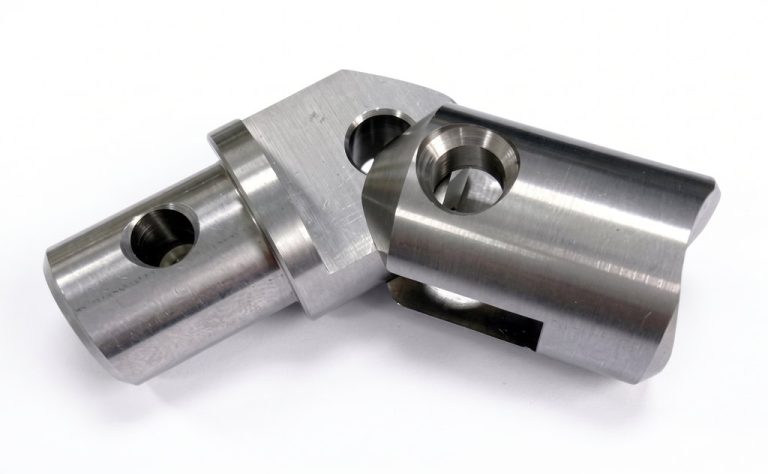 Machined metal bracket with precision holes and smooth finish