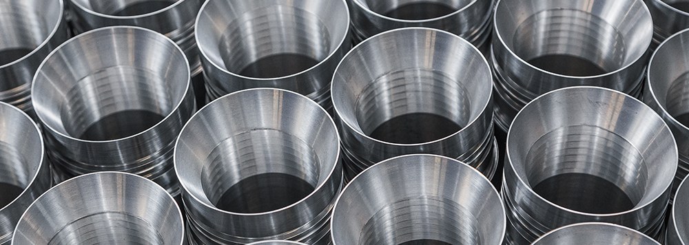 Stacked stainless steel machined cups with internal threads