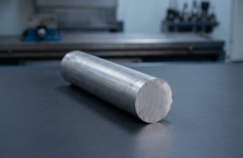 Raw stainless steel 15-5 round bar stock before CNC machining