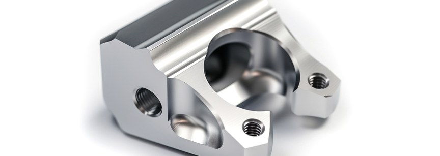 Stainless steel machined bracket on white background