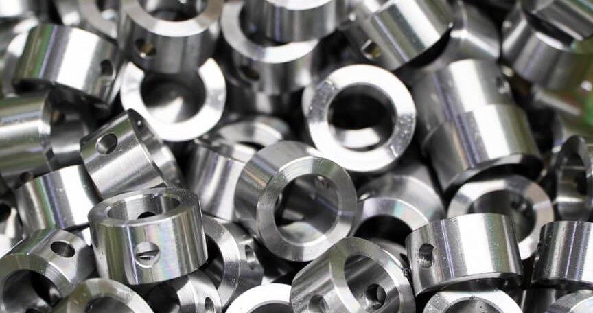 Pile of cnc-machined stainless steel bushings