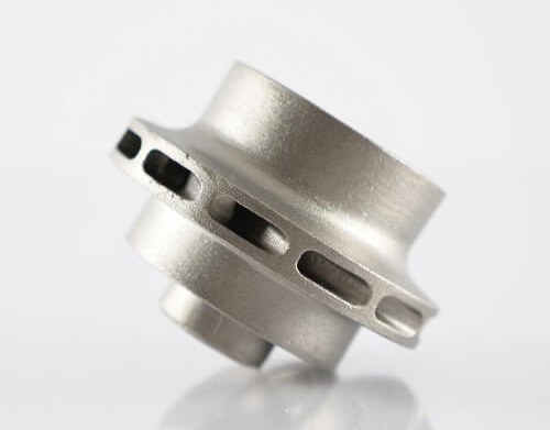 Stainless steel machined part on white background