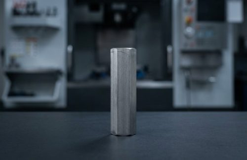 Raw hex bar stock of 303 stainless steel before machining