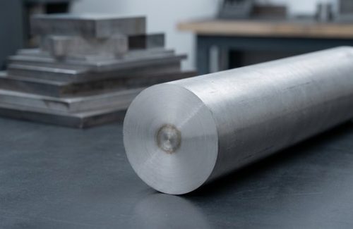Raw 304L stainless steel round bar stock before CNC machining