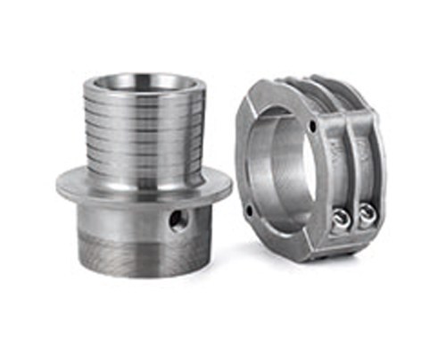 Two stainless steel machined parts on white background