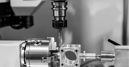 Mill-turn machining of a square aluminum part held in a lathe chuck