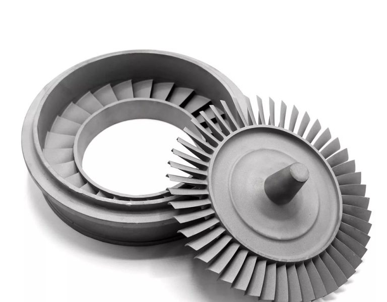 Two machined turbine impellers on white background
