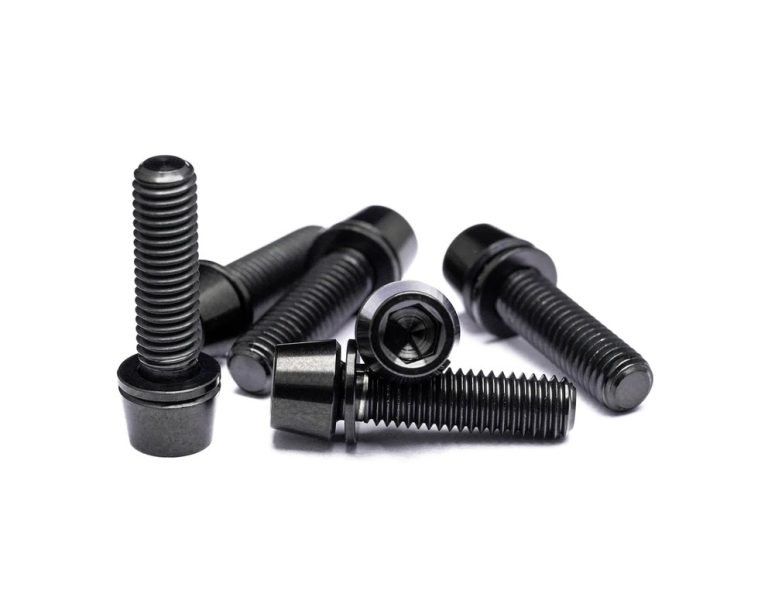 Black titanium bolts isolated on white background