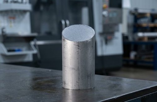 Raw titanium grade 2 round bar stock before CNC machining