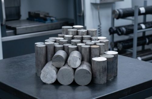 Raw titanium Grade 5 round bar stock before machining