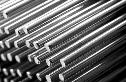 Stacked tool steel rods in diagonal rows