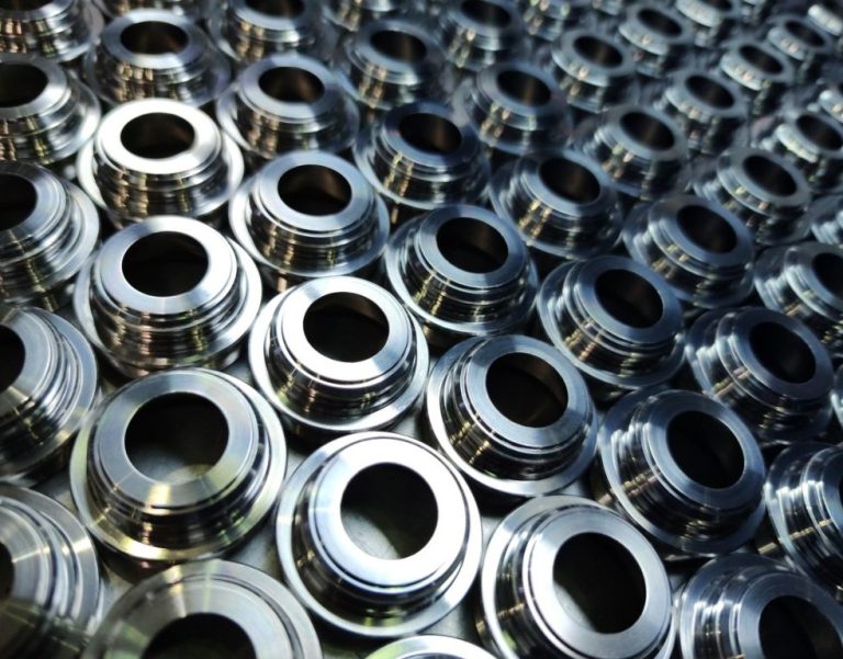 Multiple machined metal bushings in a pile