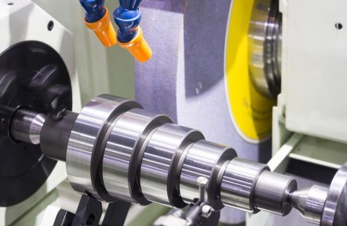 Precision cylindrical grinding of a stepped steel shaft