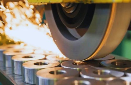 Surface grinding of steel parts with sparks