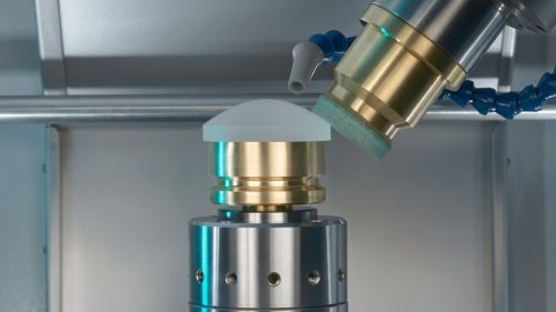 Vapor polishing process smoothing a translucent plastic CNC part
