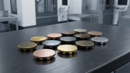 Machined metal parts showing various colors from PVD coating process